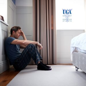 Young man sitting on the floor embarrassed about his low libido. - Griffin, GA | UGATL